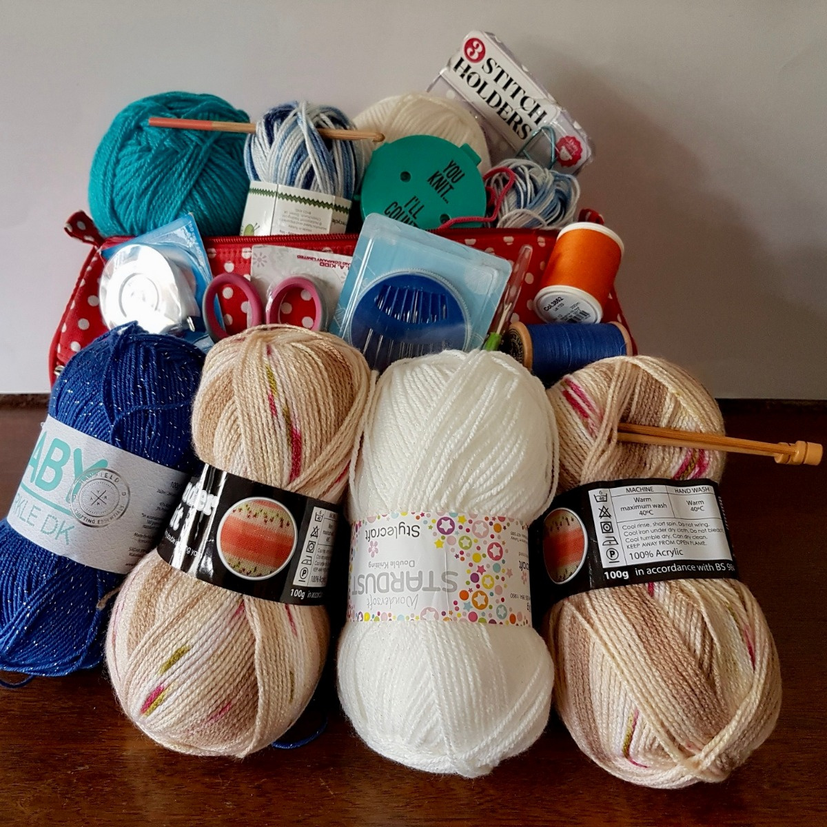A bundle of yarn, needles and haberdashery items for refugees