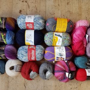 A raffle prize consisting of 18 balls and skeins of sock wool
