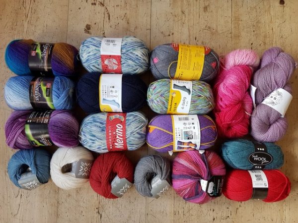 A raffle prize consisting of 18 balls and skeins of sock wool