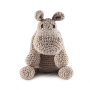 A crocheted toy hippo, made from one of our animal crochet kits.